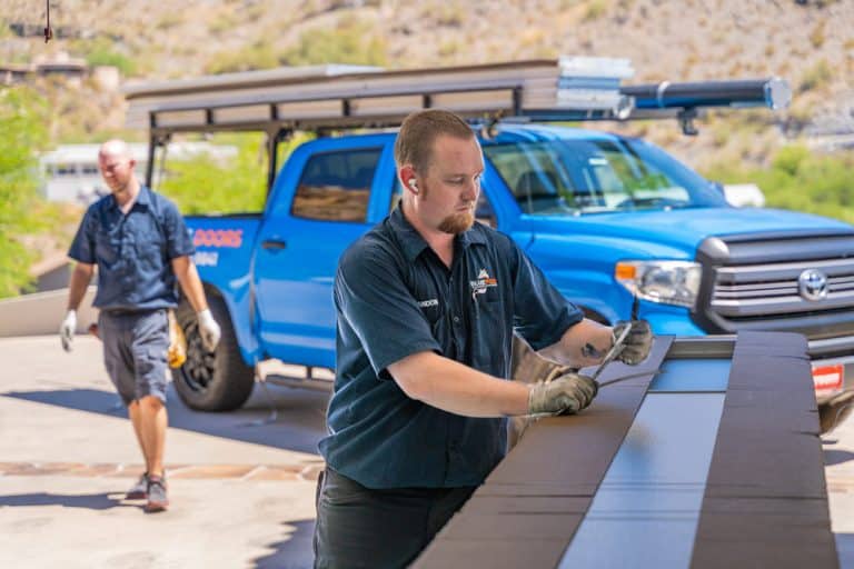 Garage Door Repair Technician Working on Arizona Garage Door Panels